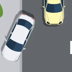 Poprawny sposób parkowania na chodniku. Biały samochód stoi prawidłowo, obok żółty. Znak zielonego zaznaczenia potwierdza.